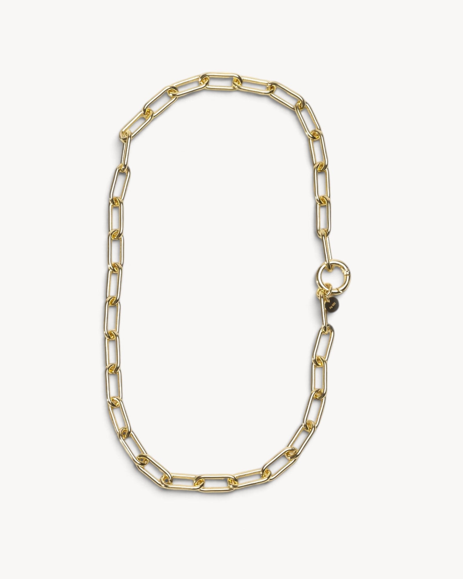 Molokai Quinn gold-toned chain link necklace with a circular clasp and small branded charm