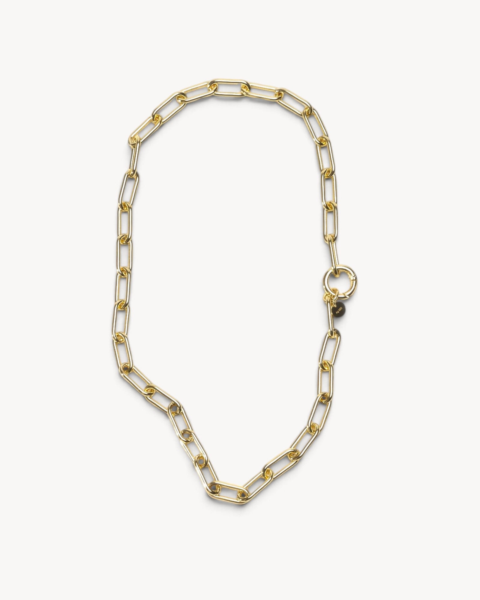 Molokai Quinn gold-toned chain link necklace with a circular clasp and small branded charm on a white background.