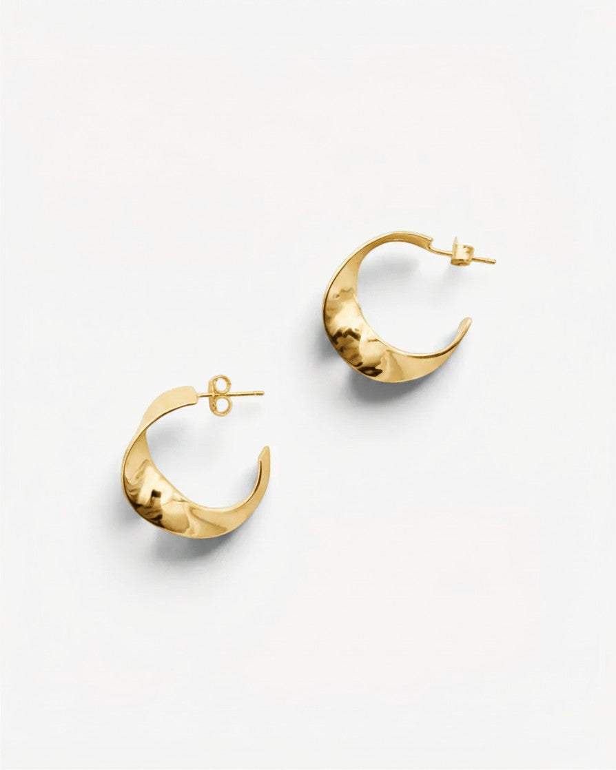Molokai Zora gold hoop earrings with a subtle twisted design for a timeless and elegant look.