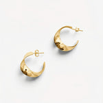Molokai Zora gold hoop earrings with a subtle twisted design for a timeless and elegant look.